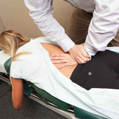 Chiropractic Louisville KY Woman Receiving Adjustment